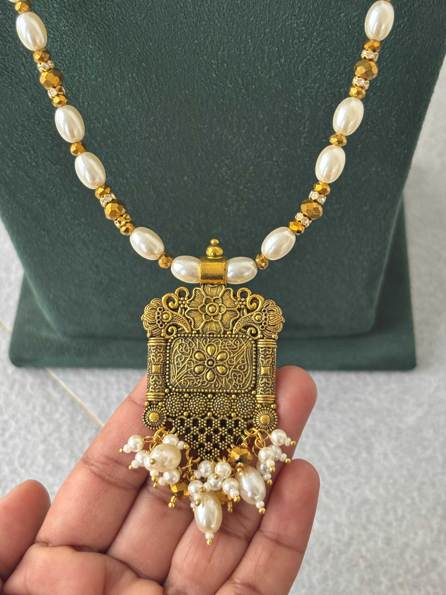 Gold Pendant and Rice Pearl Necklace