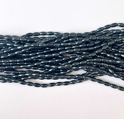 116 Pieces High Shine Monalisa Lustre Black Oval Beads