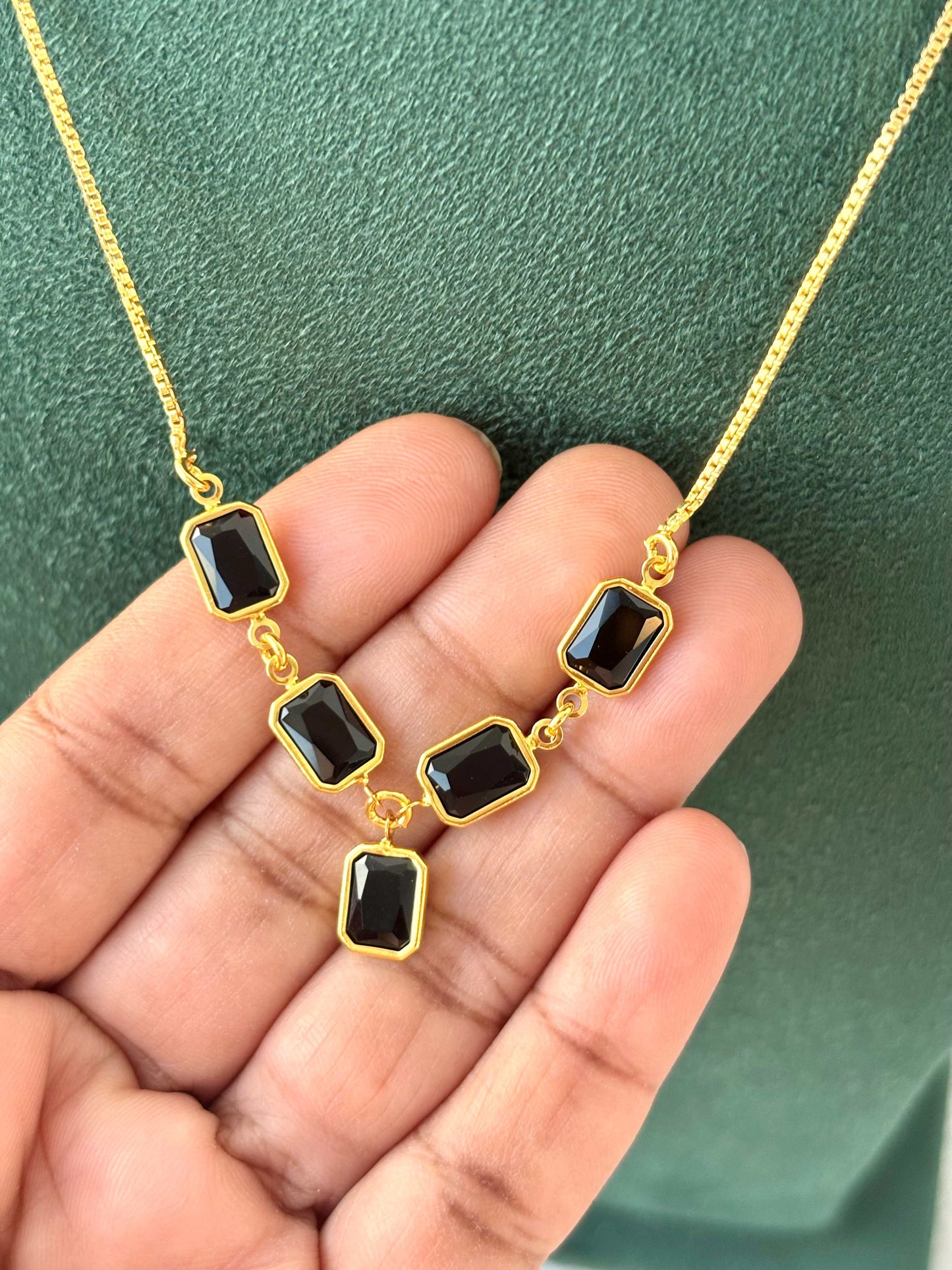Gold Necklace with Black Rectangular Gemstones