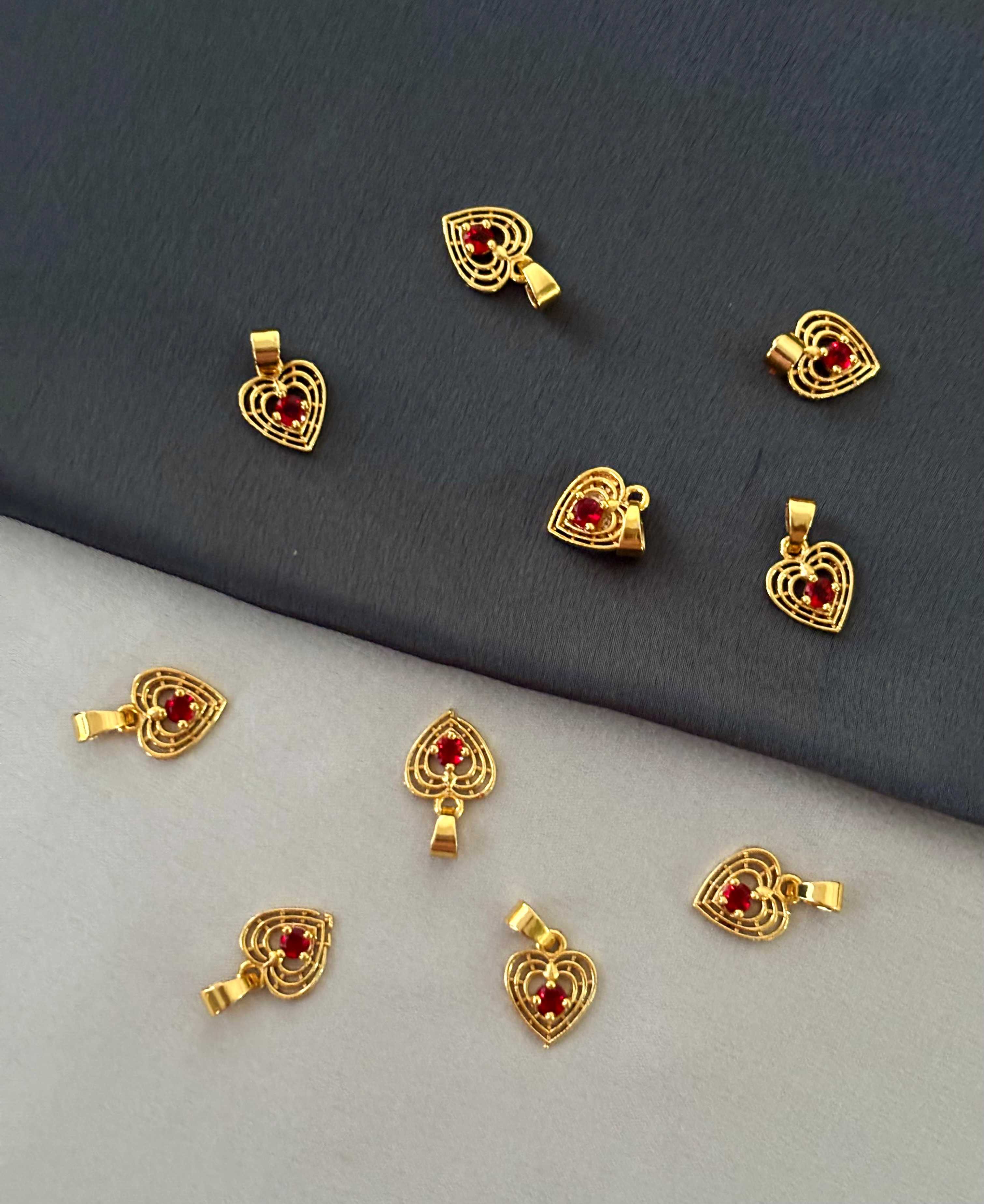 Gold-Plated Sunburst Red Stone Heart Pendant