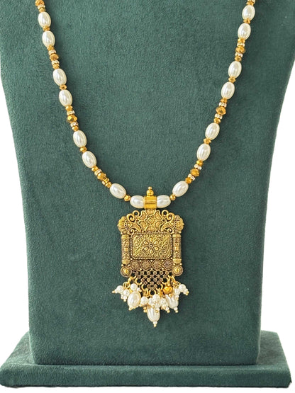 Gold Pendant and Rice Pearl Necklace