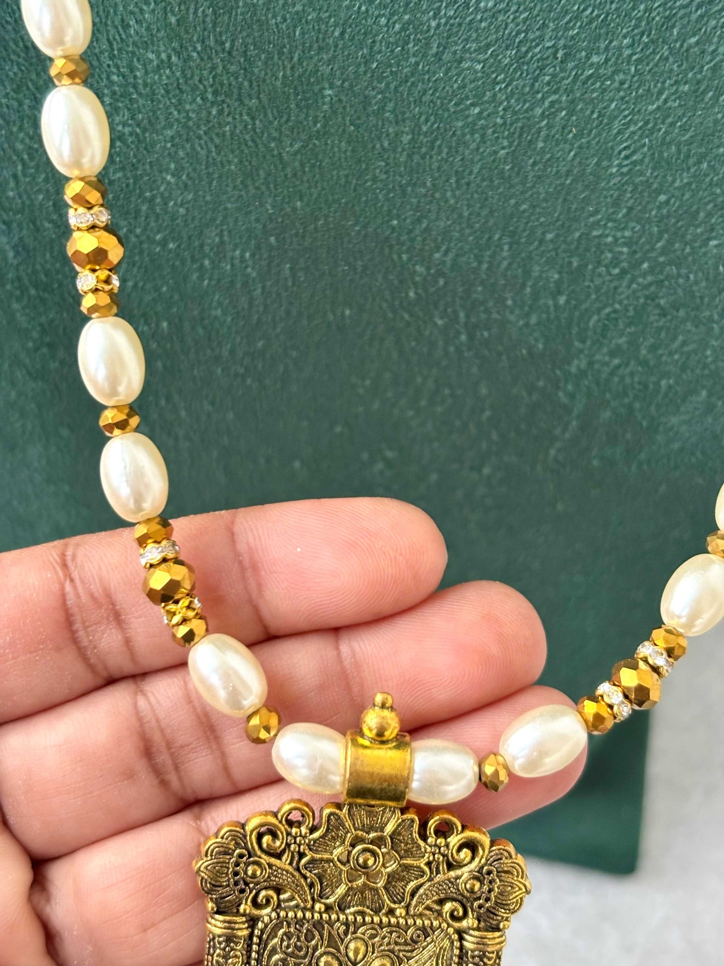 Gold Pendant and Rice Pearl Necklace