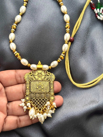 Gold Pendant and Rice Pearl Necklace