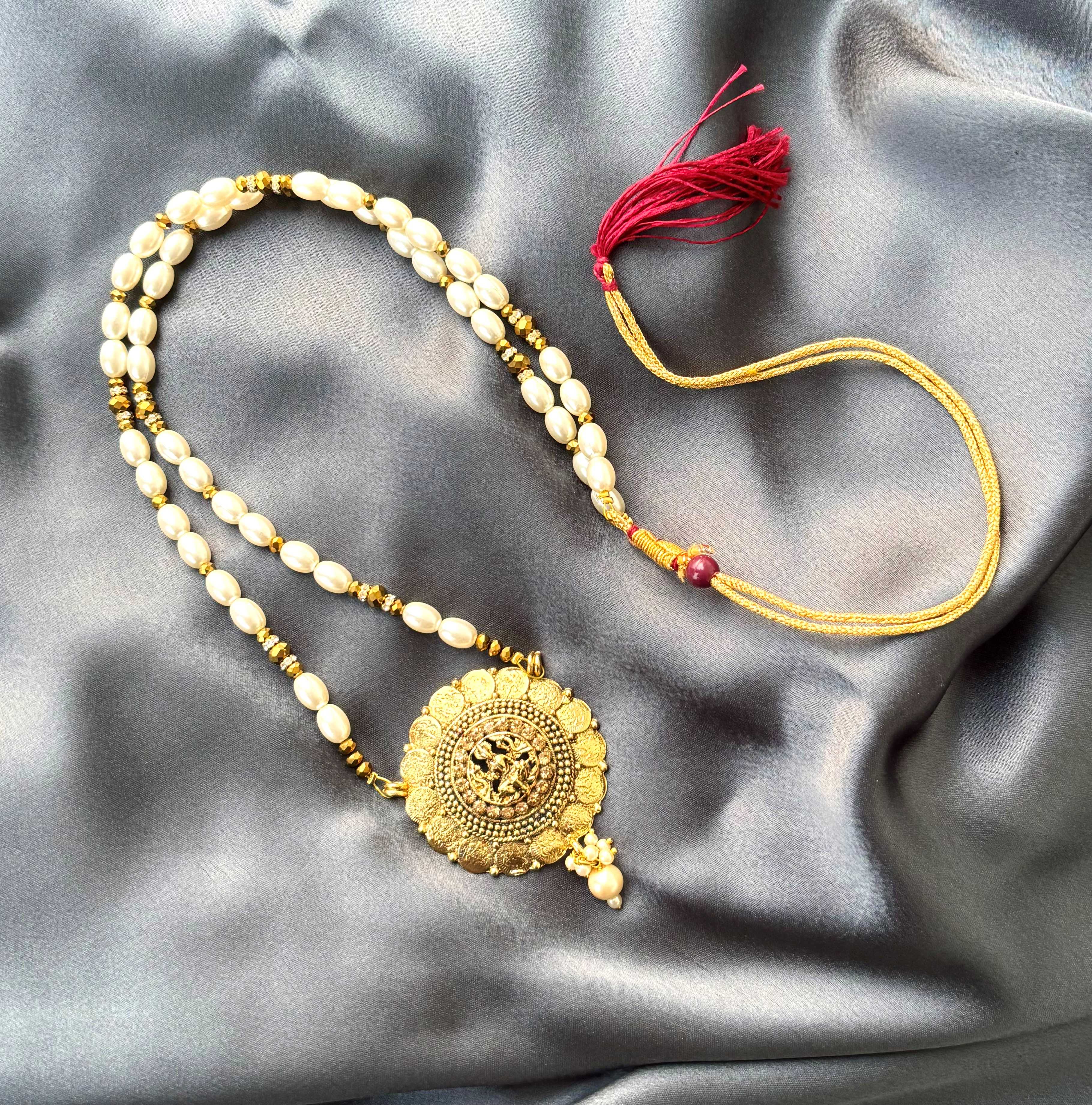 Gold Sunburst Medallion and Rice Pearl Necklace