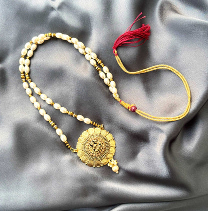 Gold Sunburst Medallion and Rice Pearl Necklace